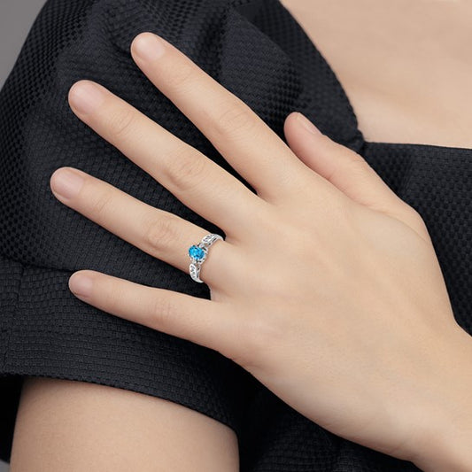 14kt White Gold 6x4mm Oval Blue Topaz A Diamond ring