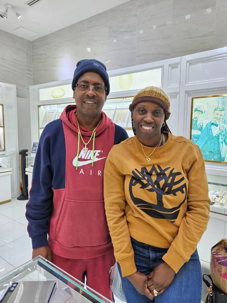 A couple standing together at the jewelry counter
