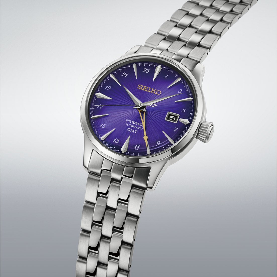 Seiko Presage Cocktail Time GMT HCB006 145th anniversary edition with purple dial on a five-link stainless steel bracelet